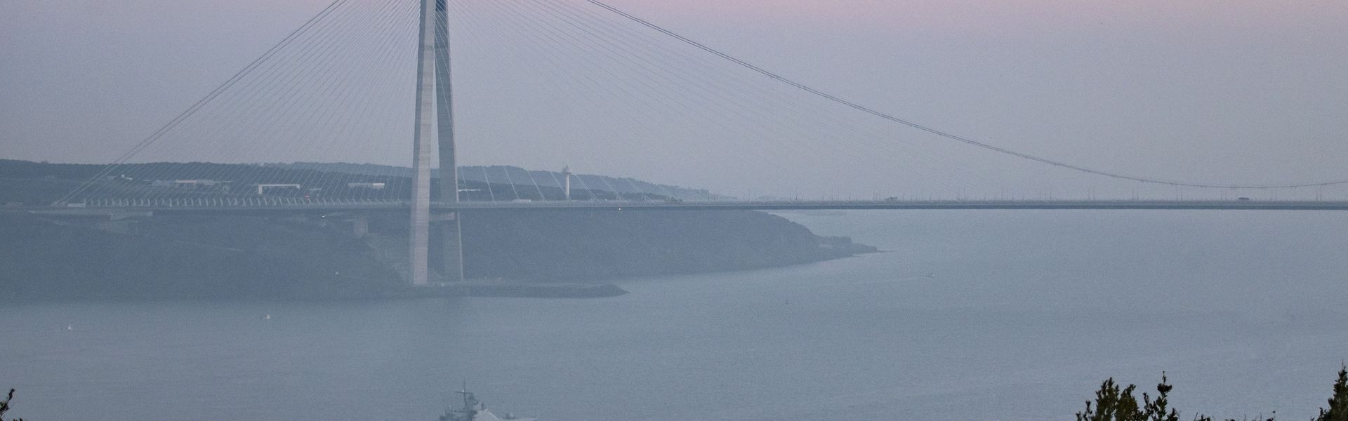 Russian Navy ships Dmitry Rogachev (375) sails near the Yavuz Sultan Selim Bridge to the Black Sea